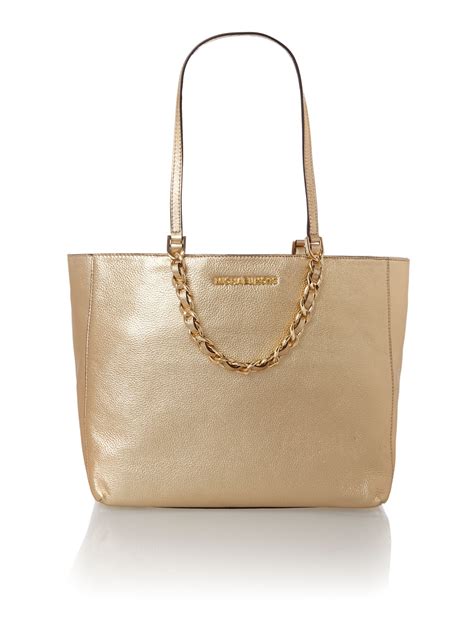 gold purse michael kors|michael kors gold evening bag.